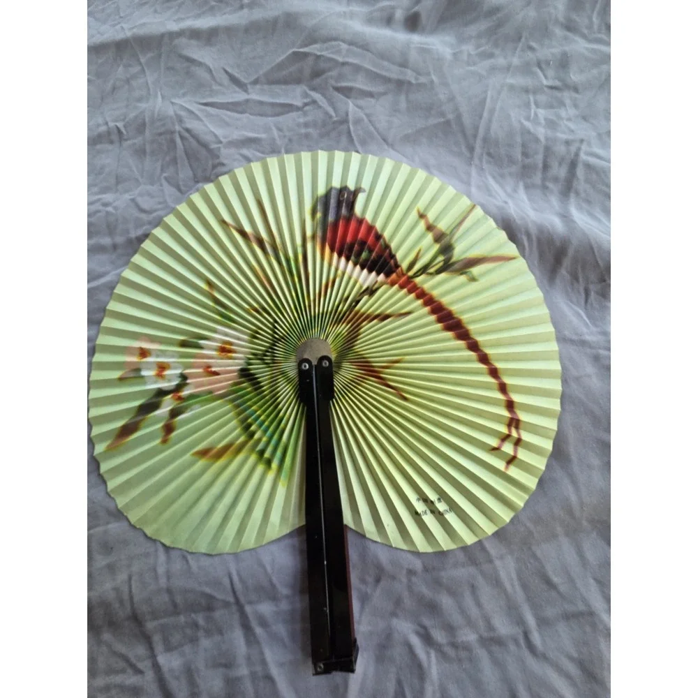 Vintage Asian Bird Floral Folding Paper Fan On A Light Green Paper Surface